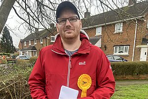 Martin Mcleod holding leaflets